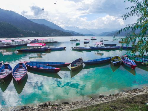 phewa,lake,pokhara,colorful,boats,moody,sky