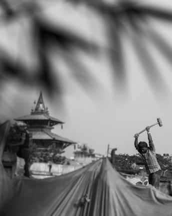 photo,basantapurkathmandu,reconstruction,kathmandu,durbar,square,world,heritage,site,background,temple,squarethe,man,foreground,working,mid,sunny,day,earn,living,good,perfect,shot,time