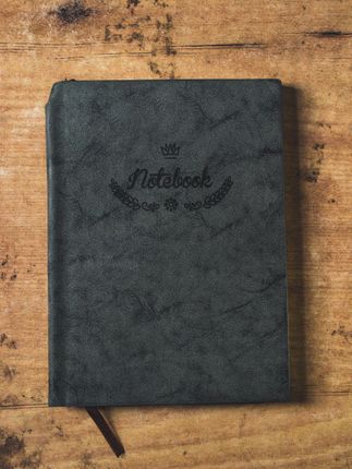 black,cover,notebook,table