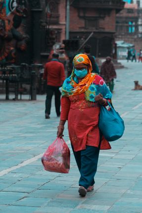 woman,covered,mask,shawl,walks,past,streets,hanumandhoka,struggle,real,lockdown,day-14