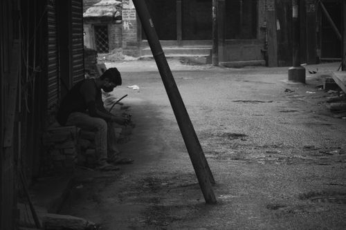 man,sitting,streets,kathmandu,time,lockdown
