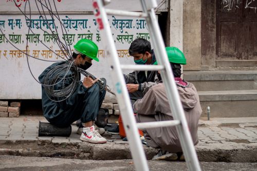 workers,telecommunication,company,repairing,giving,service,time,lockdown,kathmandu,city