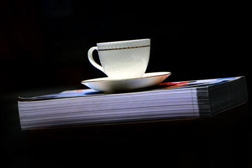 tea#,white,cup,plate#,book,image,sita,maya,shrestha