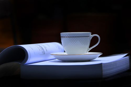 tea#,white,cup,open,book,plate#,image,sita,maya,shrestha