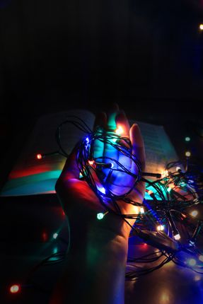 christmas,lights,hand,black,background