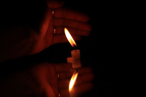 burning,candles,candle,female,hands,reflection#,stock,image,#nepal_photography#sitamayashrestha