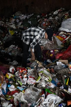 man,sorting,trash,thrown,kathmandu,produces,tons,solid,waste,day