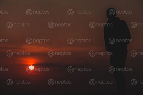Find  the Image Witnessing,the,warm,sunset,with,orange,sky. and other Royalty Free Stock Images of Nepal in the Neptos collection.