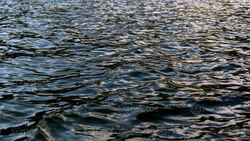 Find  the Image Waves,at,Indrasarowar,lake. and other Royalty Free Stock Images of Nepal in the Neptos collection.