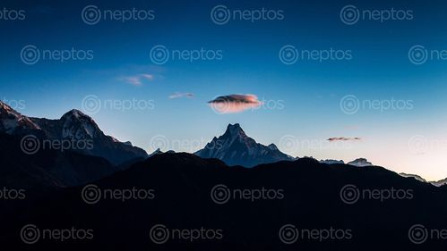 Find  the Image Cloud,UFO,over,the,Mount,Fishtail,,Ghandruk,Nepal and other Royalty Free Stock Images of Nepal in the Neptos collection.