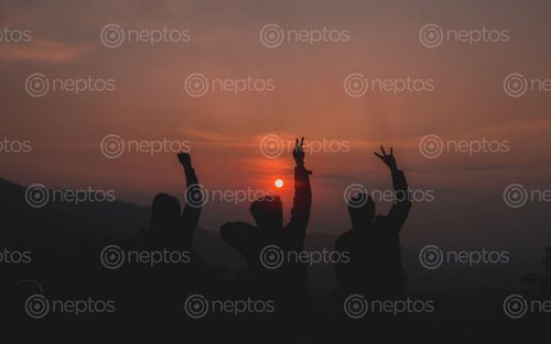 Find  the Image three friends enjoying beautiful sunset  and other Royalty Free Stock Images of Nepal in the Neptos collection.