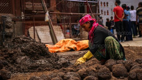 Find  the Image woman,working,reconstruction,basantapur,durbar,square,damaged,earthquake  and other Royalty Free Stock Images of Nepal in the Neptos collection.