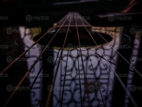 Find  the Image guitar,mantra,designed,nepal  and other Royalty Free Stock Images of Nepal in the Neptos collection.