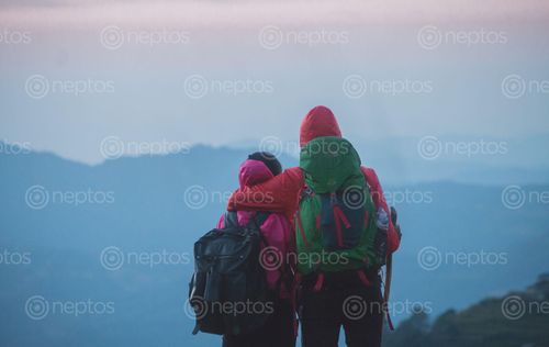 Find  the Image friends,enjoying,view,mesmeric,mountain  and other Royalty Free Stock Images of Nepal in the Neptos collection.