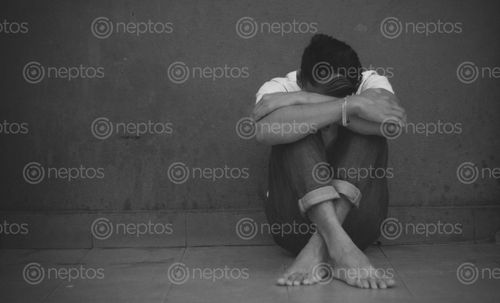 Find  the Image depressed,man,sitting,head,hands,floor,black,background  and other Royalty Free Stock Images of Nepal in the Neptos collection.