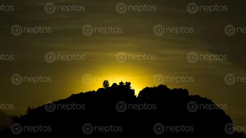 Find  the Image golden,hour,sunsets,west,creating,silhouette,lord,shiva's,hill  and other Royalty Free Stock Images of Nepal in the Neptos collection.