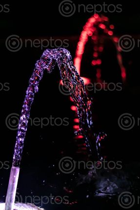 Find  the Image waterflow,hose,reflection,blue,red,light,water  and other Royalty Free Stock Images of Nepal in the Neptos collection.