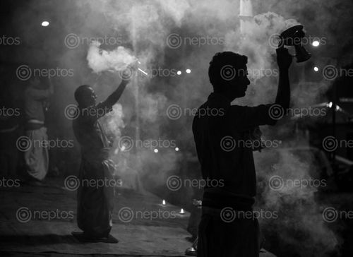 Find  the Image mesmerizing,rituals,pashupatinath,temple,aarati,bagmati,holy,river,flows,divides,sides,main,side,location,ritual,worship,light,wicks,soaked,ghee,purified,butter,offered,god,pashupati,priests,conducting,custom,oil,lamps,lanterns,religious,elements,chanting,sacred,mantra,perform,taking,moving,circular,motion,dedicating,act,divine,bhajan,songs,theme,sung,devotees,creating,blissful,surrounding,starts,pm,evening,part,creates,environment,union,started,year,established,regular,tradition,practice,captivating,thousands,people,hindu,religion,considered,valuable,song,prayer,finally,important,highest,form,offers,reverence,dance,called,tandav,performed,followers,load,shiva,paying,respect,lord,major,attraction,widely,recognized,holidays,mondays,festivals,monday,day,ensuring,large,number  and other Royalty Free Stock Images of Nepal in the Neptos collection.