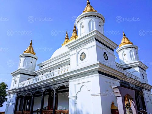 Find  the Image photo,rammandir,clean,blue,sky  and other Royalty Free Stock Images of Nepal in the Neptos collection.