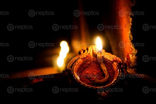 Find  the Image diyo-is,oil,lamp,india,nepal,made,clay,cotton,wick,dipped,ghee,vegetable,oils  and other Royalty Free Stock Images of Nepal in the Neptos collection.