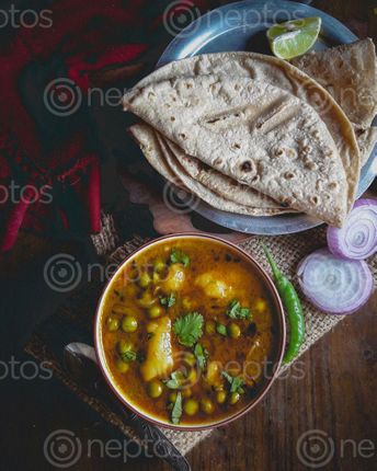 Find  the Image image,popular,nepali,meal,roti,tarkari,flatlay,potato,pea,curry  and other Royalty Free Stock Images of Nepal in the Neptos collection.