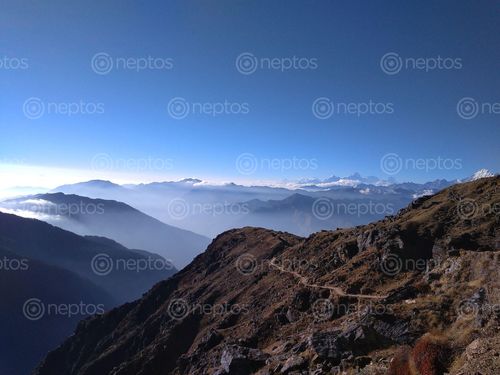 Find  the Image trail,leads,holy,gosainkunda,lake,langtang,mountain,range,background  and other Royalty Free Stock Images of Nepal in the Neptos collection.