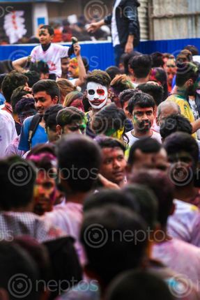 Find  the Image boy,standing,crowd,face,paint,occasion,holi,festival,colors  and other Royalty Free Stock Images of Nepal in the Neptos collection.