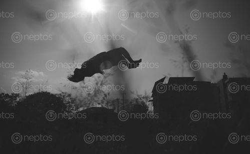 Find  the Image silhouette,man,backflip,dark,environment  and other Royalty Free Stock Images of Nepal in the Neptos collection.