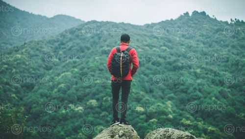 Find  the Image young,boy,standing,facing,hills,bag,back  and other Royalty Free Stock Images of Nepal in the Neptos collection.
