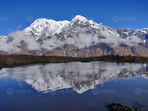 Find  the Image mountain,reflection  and other Royalty Free Stock Images of Nepal in the Neptos collection.