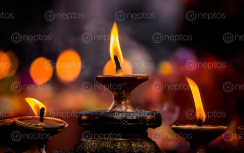Find  the Image burning,candle,light,kathmandu,nepal  and other Royalty Free Stock Images of Nepal in the Neptos collection.