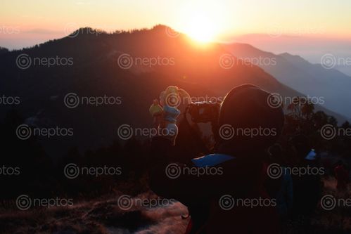 Find  the Image girl,capturing,mahestic,view,mountains,cell-phone,poonhill,point  and other Royalty Free Stock Images of Nepal in the Neptos collection.