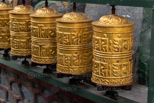 Find  the Image prayer,wheels,spinned,devotees,order,aid,meditation,accumulating,wisdom,good,karma,putting,negative,energy  and other Royalty Free Stock Images of Nepal in the Neptos collection.