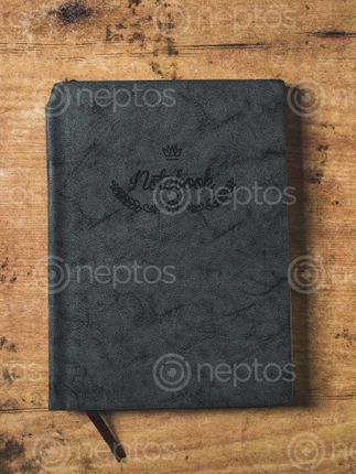 Find  the Image black,cover,notebook,table  and other Royalty Free Stock Images of Nepal in the Neptos collection.
