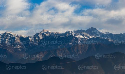 Find  the Image white,snowed,mountain,blue,sky  and other Royalty Free Stock Images of Nepal in the Neptos collection.
