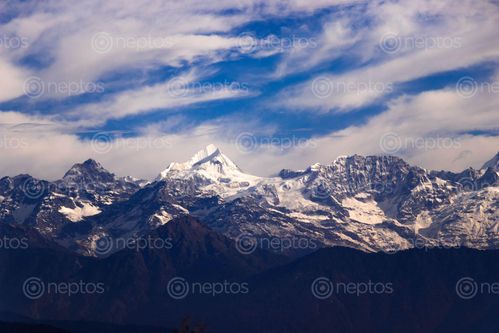 Find  the Image white,snowed,mountain,blue,sky  and other Royalty Free Stock Images of Nepal in the Neptos collection.