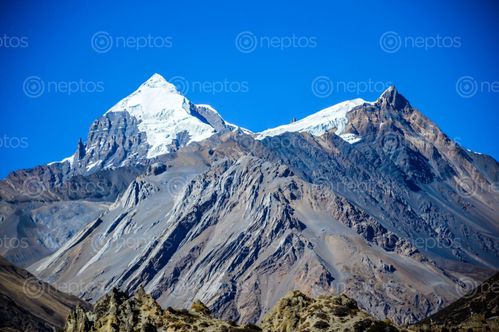 Find  the Image rock,hill,snow,peak  and other Royalty Free Stock Images of Nepal in the Neptos collection.