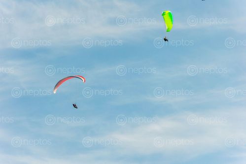 Find  the Image men,flying,sky,paragliding,pokhara,nepal  and other Royalty Free Stock Images of Nepal in the Neptos collection.