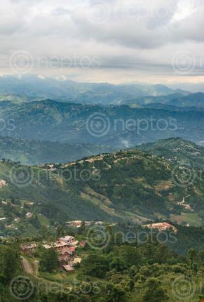 Find  the Image cloudy,day,offers,view,hills,surrounding,nagarkot,picture,form,place,called,yeti,cave,kilometers,bazar,viewtower  and other Royalty Free Stock Images of Nepal in the Neptos collection.