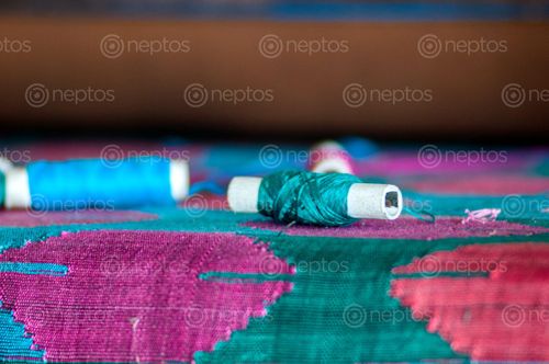Find  the Image colorful,threads,preparation,traditional,nepali,hand,woven,fabric,dhaka  and other Royalty Free Stock Images of Nepal in the Neptos collection.