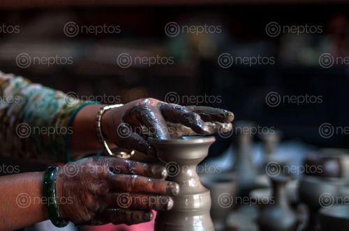 Find  the Image pala,palcha,small,bowl,shaped,clay,pot,light,oil,lamp,made,cotton,thread,process,making,bhakatapur,pottery,square,nepal  and other Royalty Free Stock Images of Nepal in the Neptos collection.