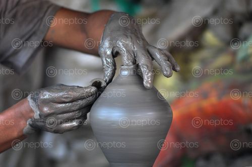 Find  the Image guy,making,pottery,khutruke-traditional,vessel,collect,money,bhaktapur,squarenepal  and other Royalty Free Stock Images of Nepal in the Neptos collection.