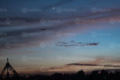Find  the Image aeroplane,flies,sky,lovely,evening,beauty,added,moon  and other Royalty Free Stock Images of Nepal in the Neptos collection.