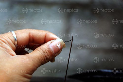 Find  the Image hands,woman,needle,thread,sms,photography  and other Royalty Free Stock Images of Nepal in the Neptos collection.