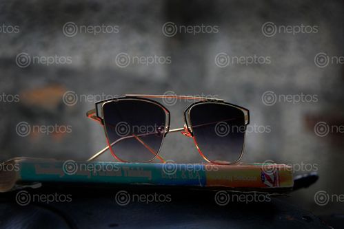 Find  the Image sunglasses,book,image,sms,photography  and other Royalty Free Stock Images of Nepal in the Neptos collection.