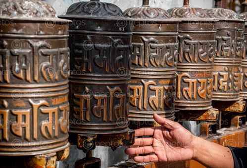 Find  the Image person,rotating,prayer,wheel,baudhanath,stupa  and other Royalty Free Stock Images of Nepal in the Neptos collection.