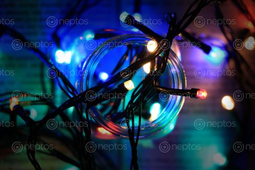 Find  the Image christmas,lights,glass,bottle,black,background  and other Royalty Free Stock Images of Nepal in the Neptos collection.