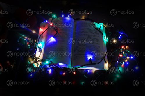 Find  the Image christmas,lights,book,black,background  and other Royalty Free Stock Images of Nepal in the Neptos collection.