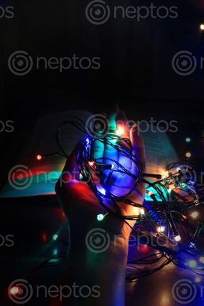 Find  the Image christmas,lights,hand,black,background  and other Royalty Free Stock Images of Nepal in the Neptos collection.