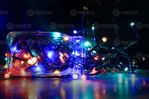 Find  the Image christmas,lights,glass,bottle,black,background  and other Royalty Free Stock Images of Nepal in the Neptos collection.